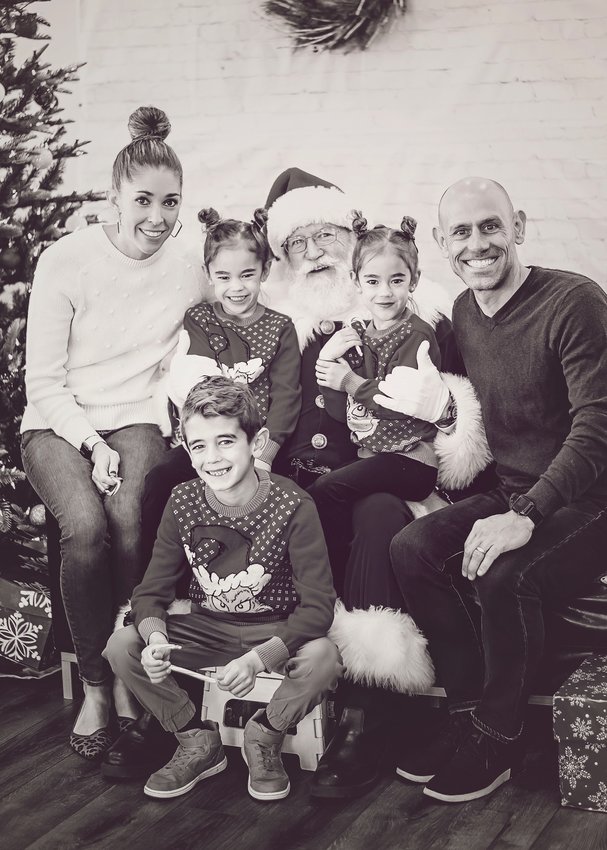 The Conley family with Santa, from left, Kendal, Kenna, Zoey, Tyler, and Beckham in the front.
